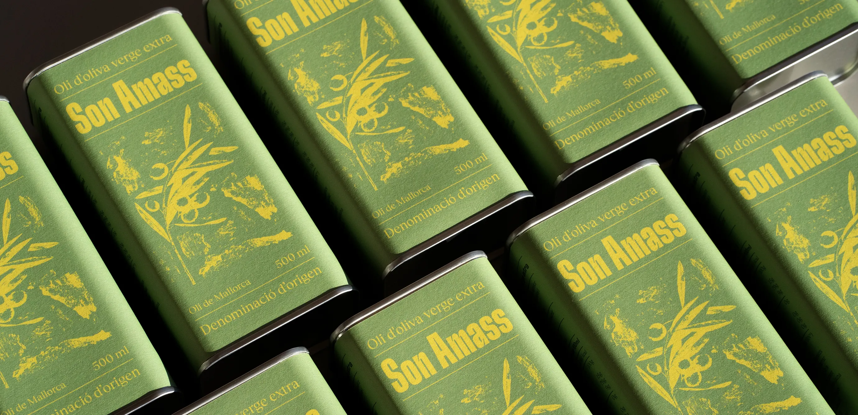 Extra virgin olive oil cans from Son Amass displayed in a batch.