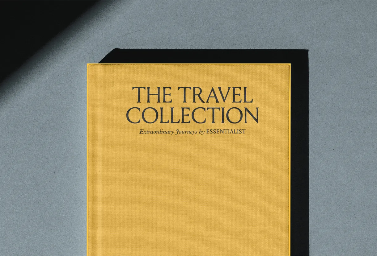 Hard cover of "The Travel Collection" by Essentialist, with dark characters over a yellow cover.